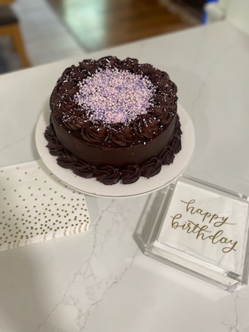 Chocolate cake topped with pastel sprinkles